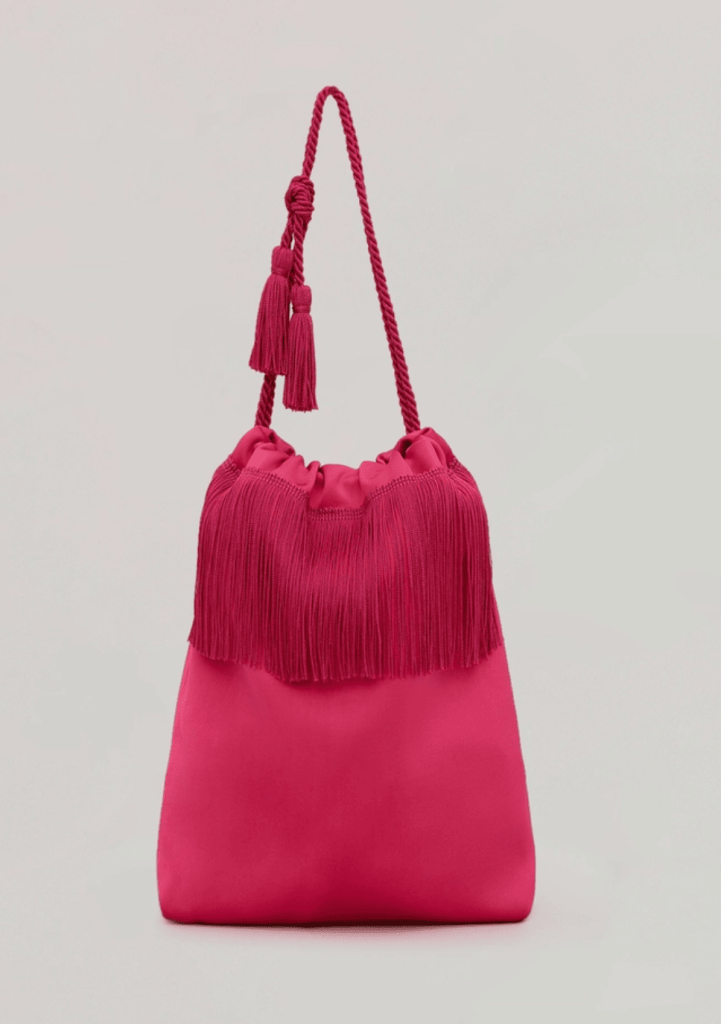 Foto del bolso de mano color magenta de Marina Rinaldi, colección Now